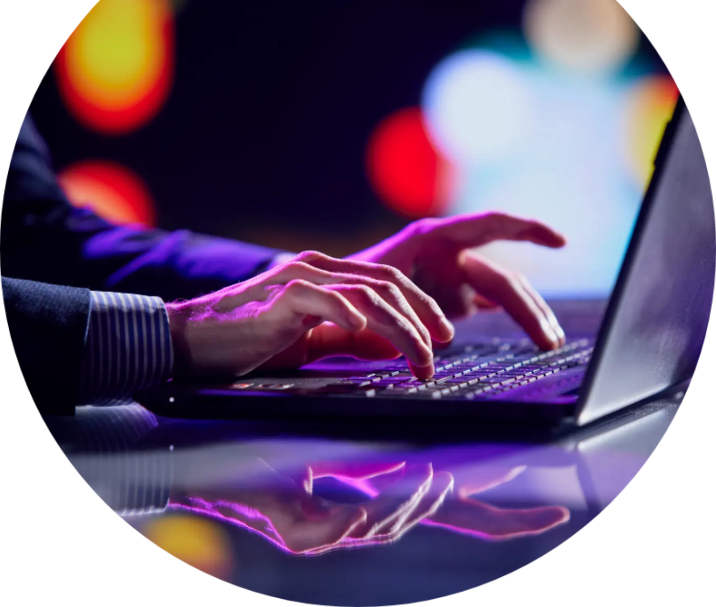 Hands typing a claim report on a laptop