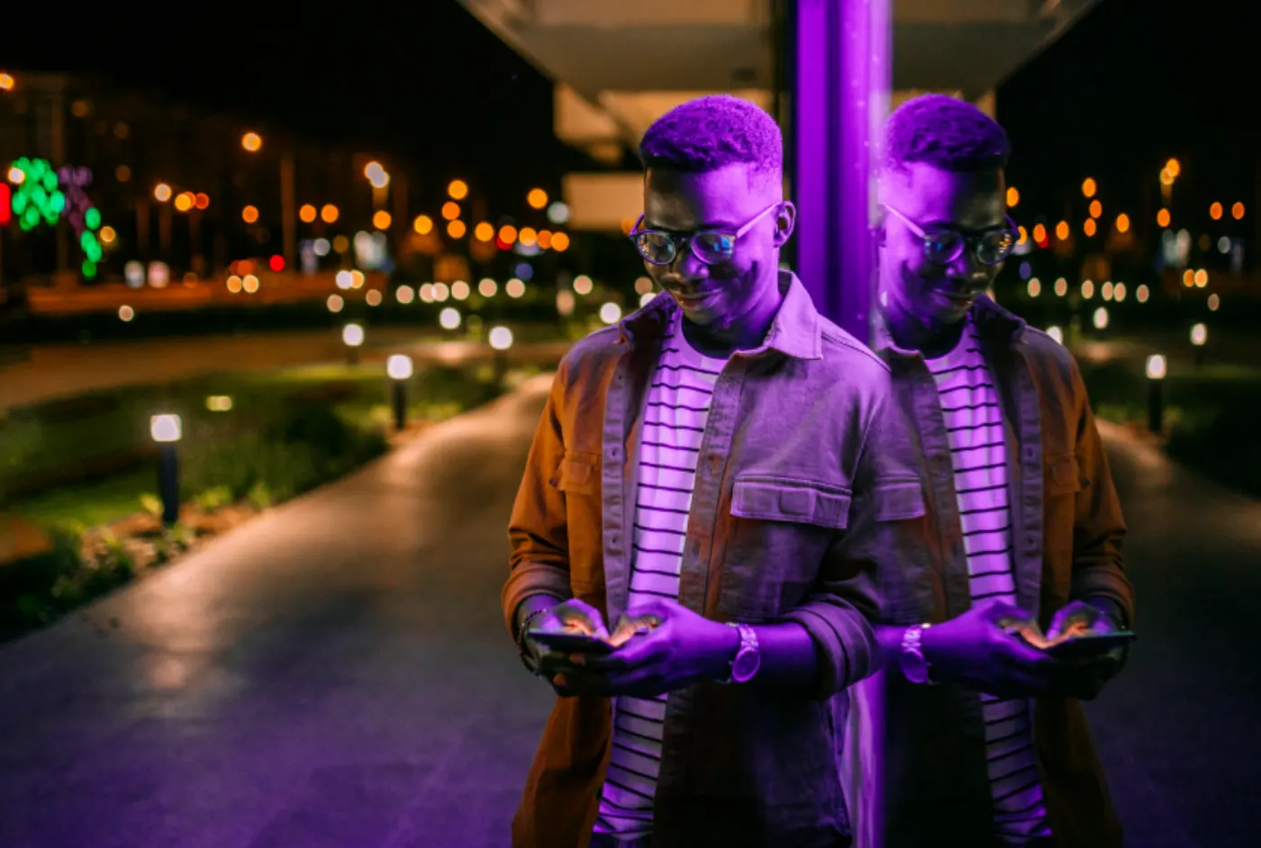 A broker reviewing a policy on a phone at night